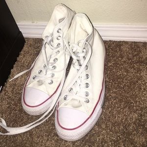 White high top converse with red line